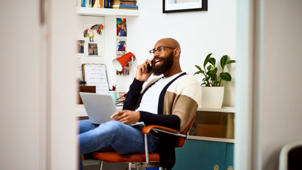 Small business owner on phone at home